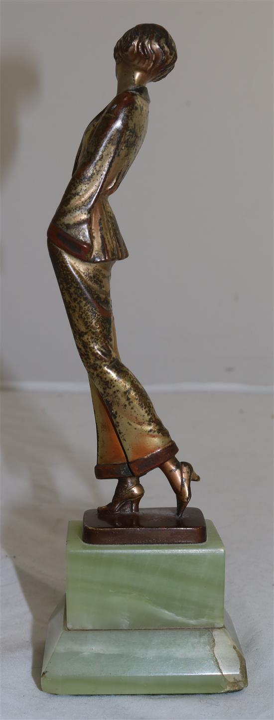 A Lorenzl patinated bronze figure of a young lady wearing a pyjama suit, 9in.